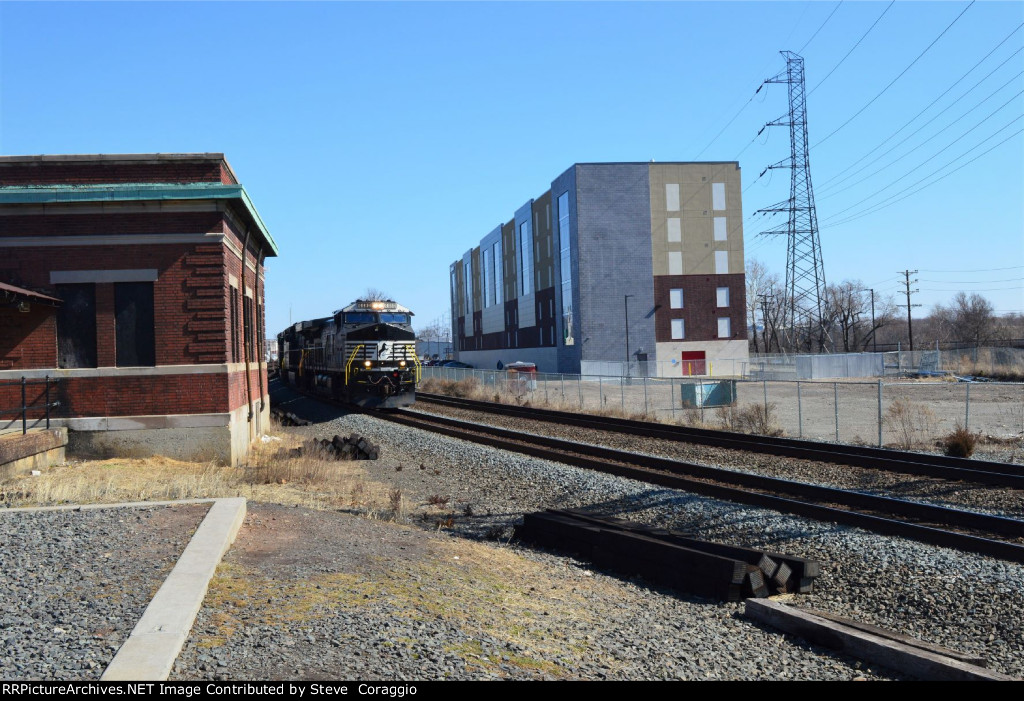 NS 4480 Passes Between Old and New Buildings